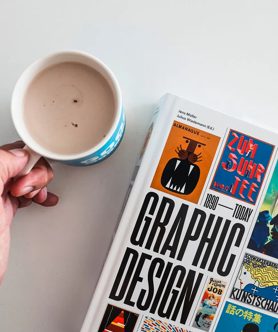 Graphic design books on a desk