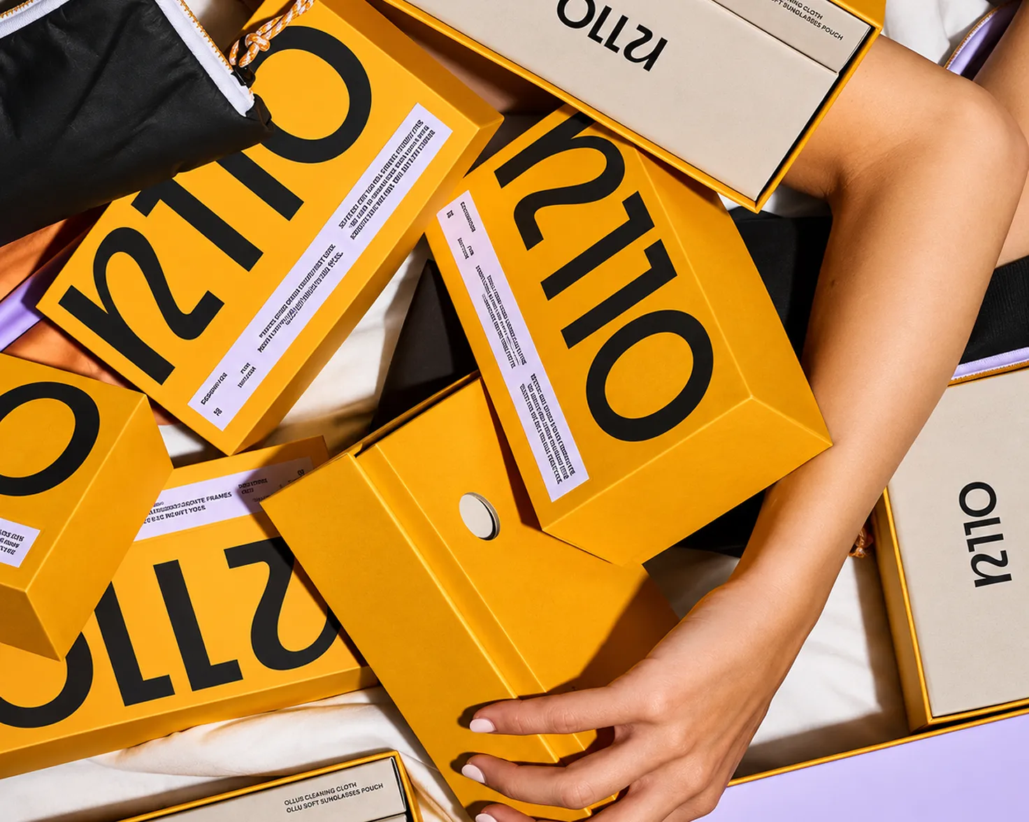 Branded yellow product boxes and cartons in a stack