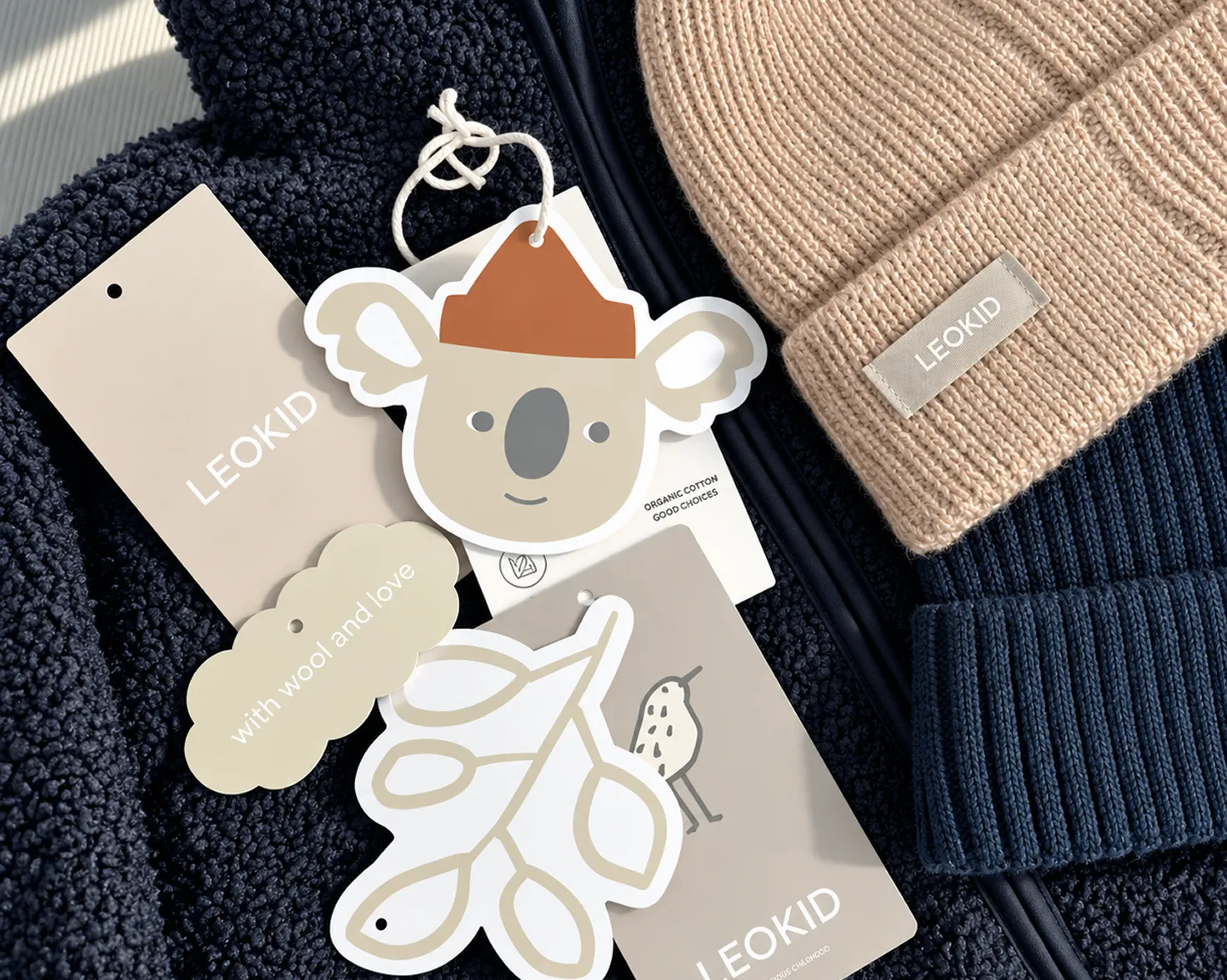 A range of illustrated swing-tag variants on knitwear