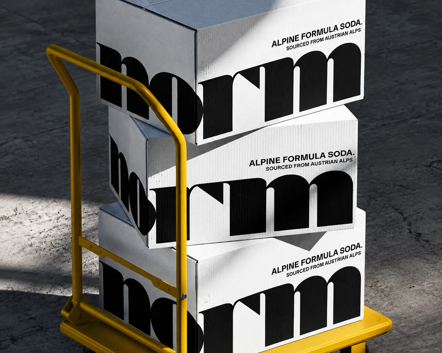 Branded soda carton packaging stacked on a hand truck
