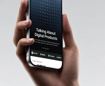 An event app on a phone held in hand