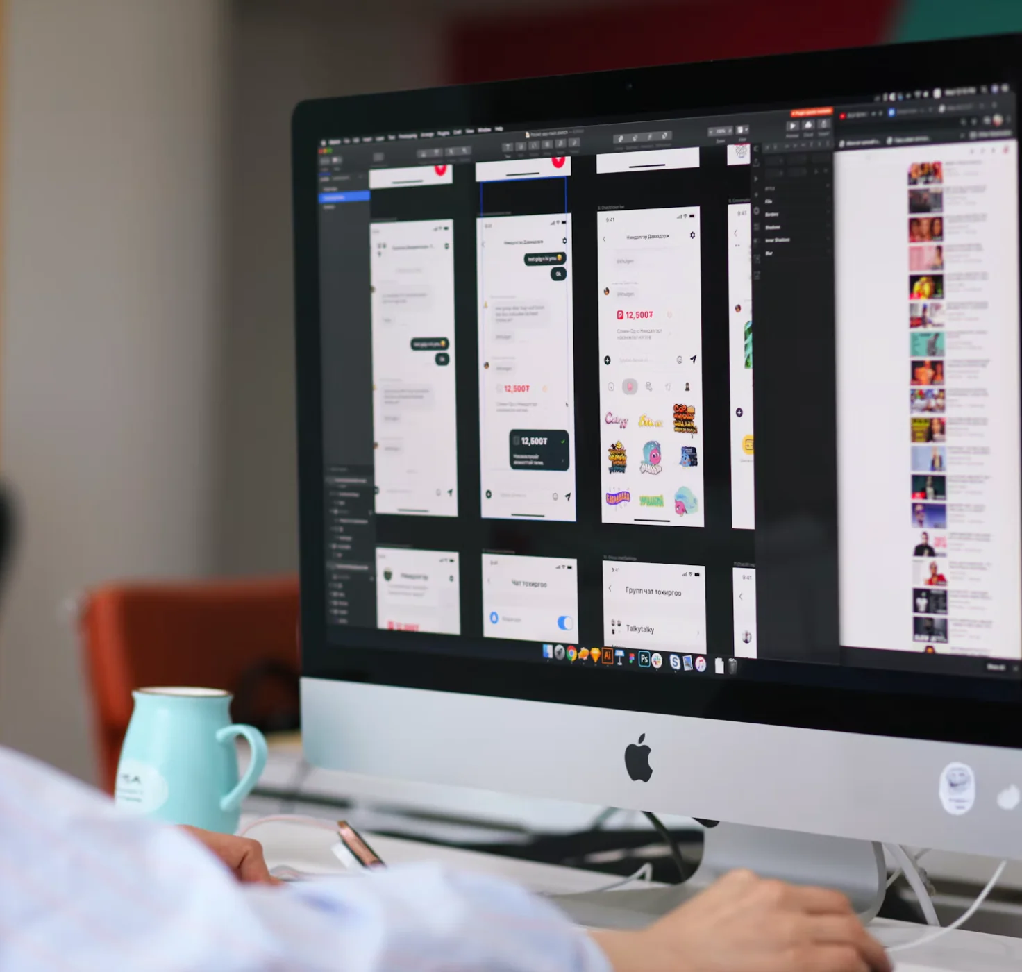 A web app design file open on a desktop monitor
